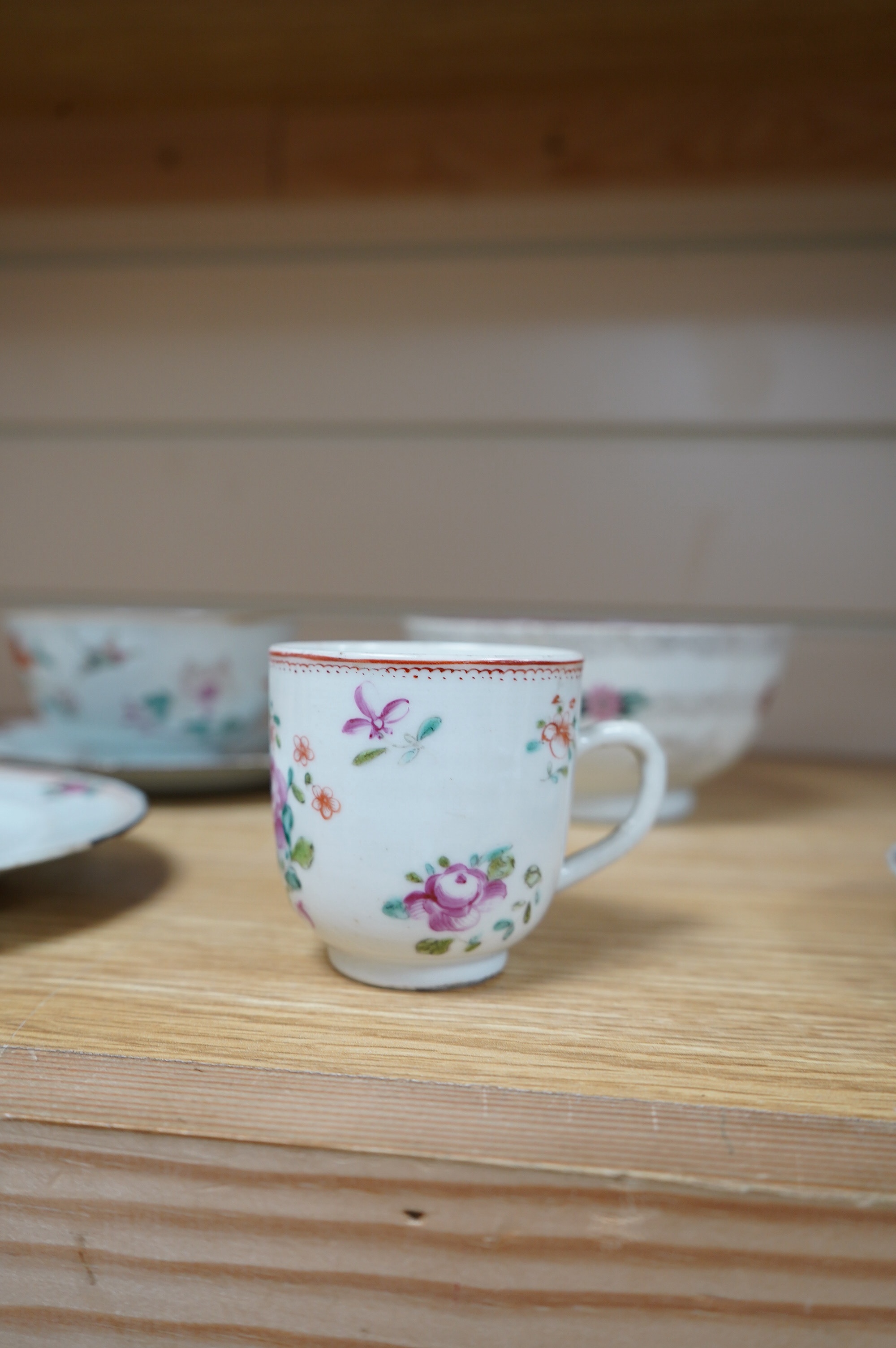 Three small 18th century Chinese export porcelain dishes, three bowls and a cup, largest 14cm. Condition - poor